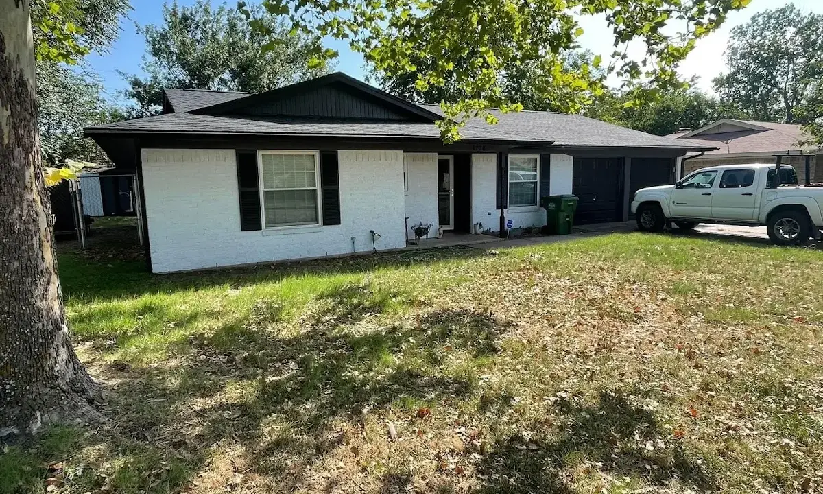 Professional roofing crew working on a residential roof in Bon Air